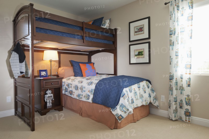 Bunk bed with study desk in kids bedroom at home