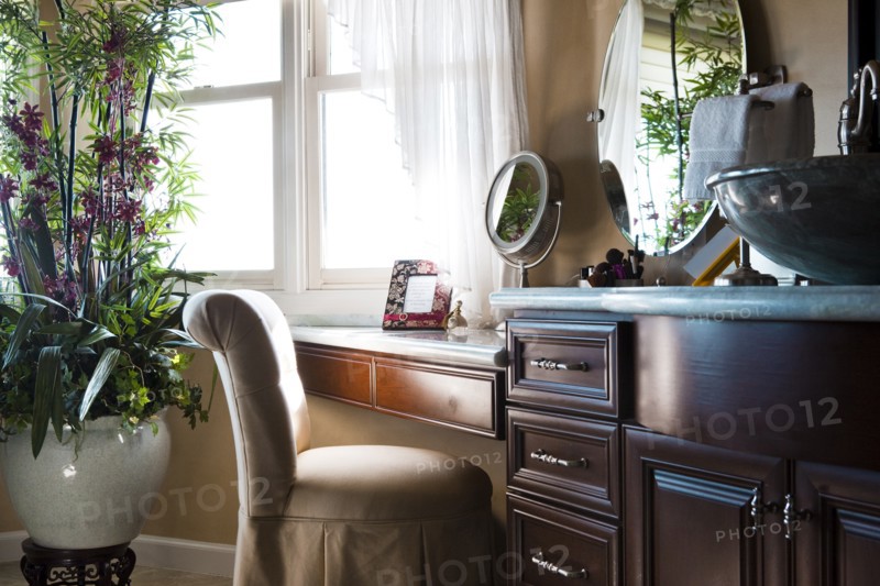 Chair at dressing table in bathroom at home