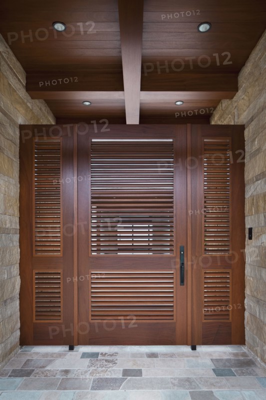 Foyer with closed wooden door