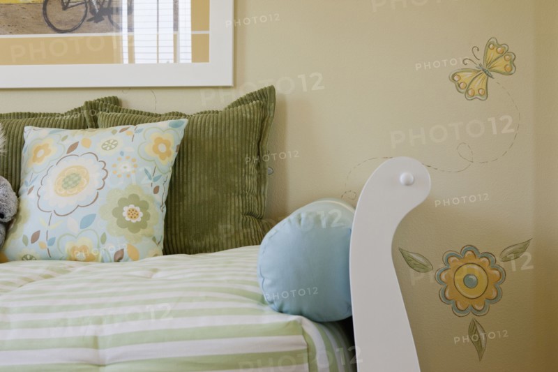 Close-up of cropped couch against designed wall at home