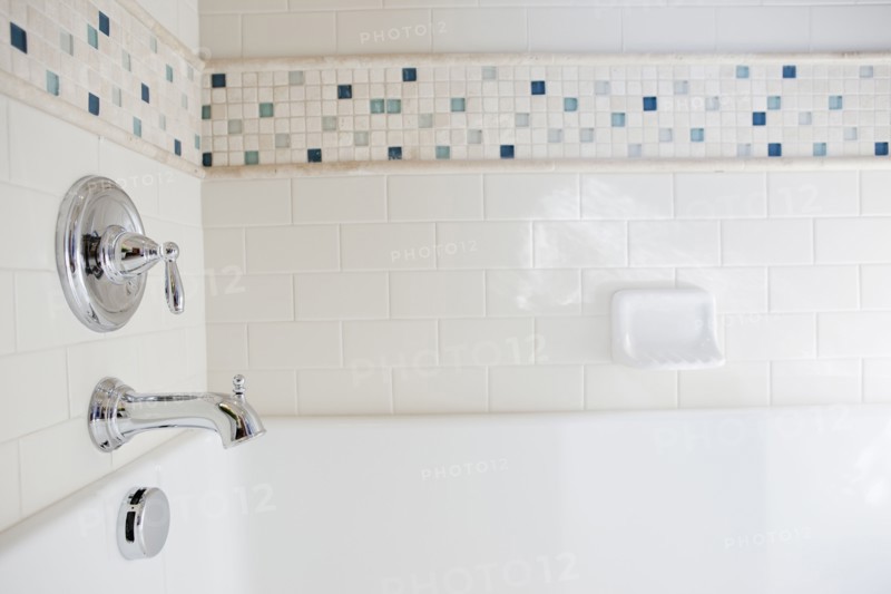 Close-up of shower taps in bathroom at home