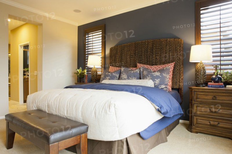 Interior of tidy bedroom of middle class house