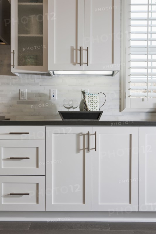 White cabinets and tray in domestic kitchen