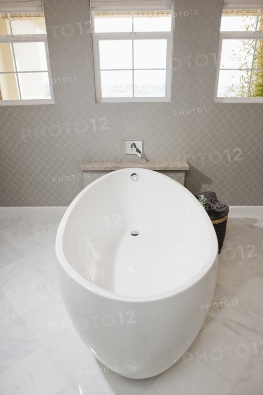 White free standing bathtub in contemporary bathroom
