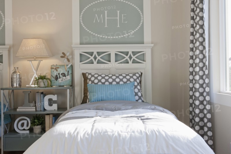 Bed and night table in middle class house