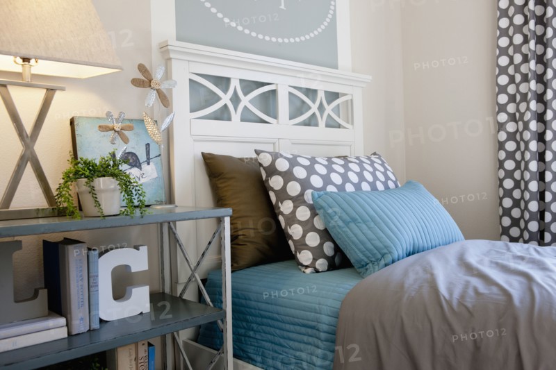 Bed and night table in middle class house