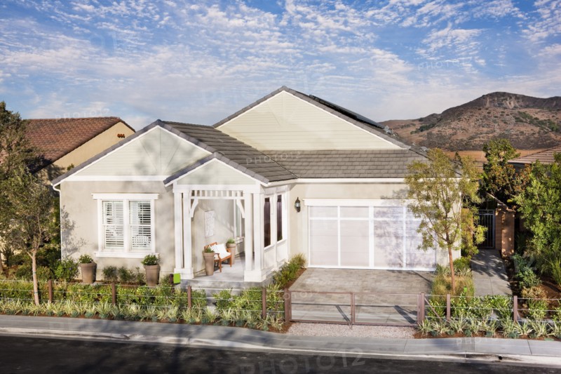 Exterior of a one story house with garage