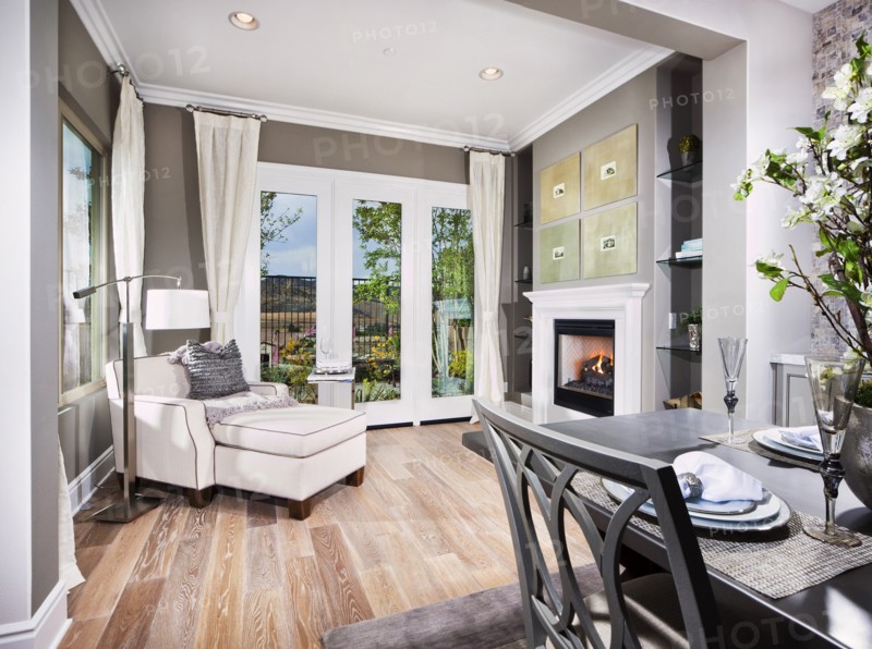Sunroom with easy chair and footstool in house