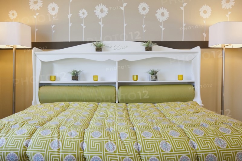 Interior of child's bed with floor lamps