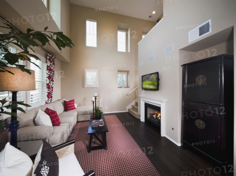 Small contemporary sitting room with red accents