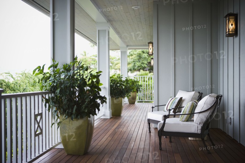 Two chairs on front porch of Hawaiian home