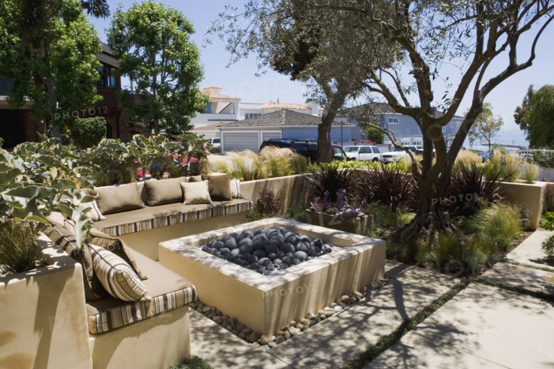 Outdoor sitting area with fire pit and sofa