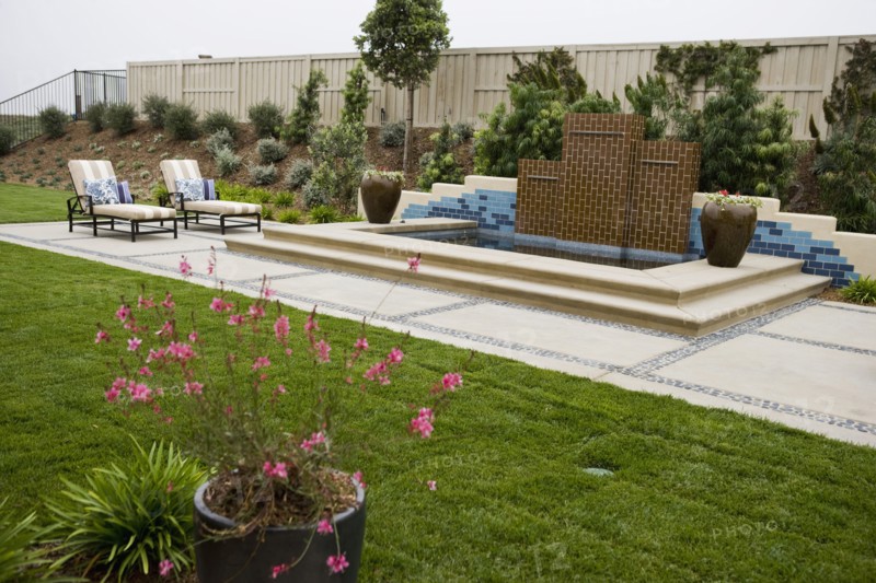 Back patio with contemporary fountain