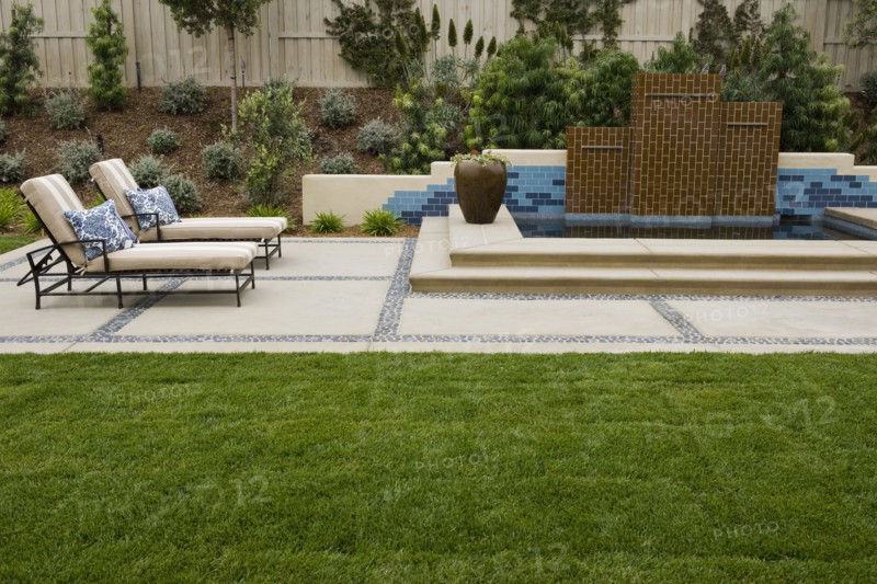 Back patio with contemporary fountain