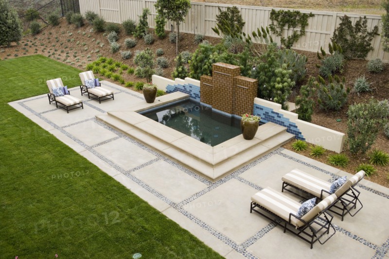 Back patio with contemporary fountain