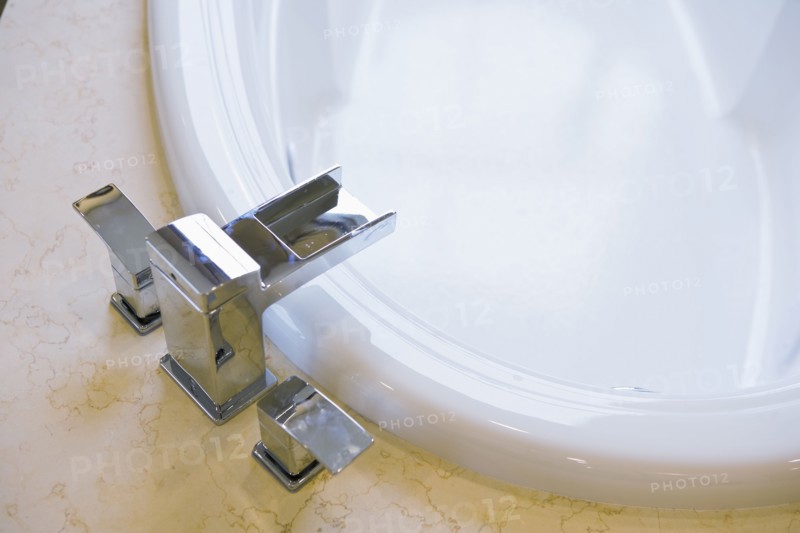 Contemporary faucet above bathtub