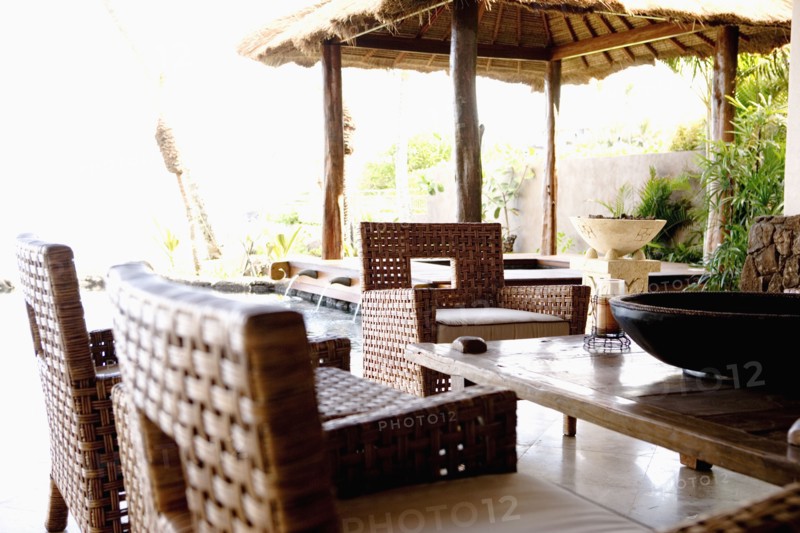 Tropical dining room with armchairs
