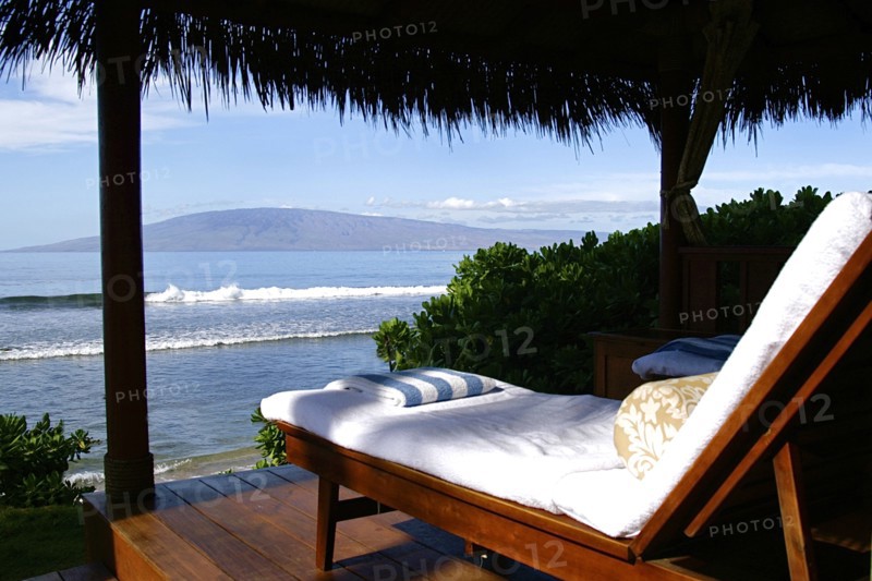 Lounge chair on deck overlooking ocean