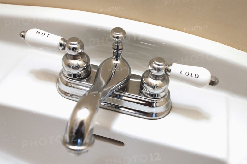 Detail faucet labeled hot and cold