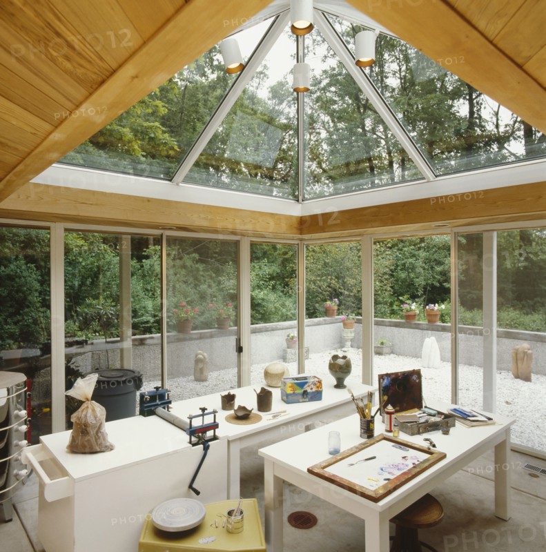 Cedar tongue and groove ceiling with glass sliding doors and skylights