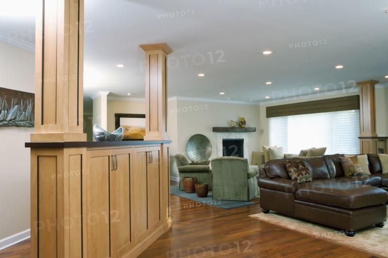 Interior of traditional living room with leather seating furniture and hardwood floor