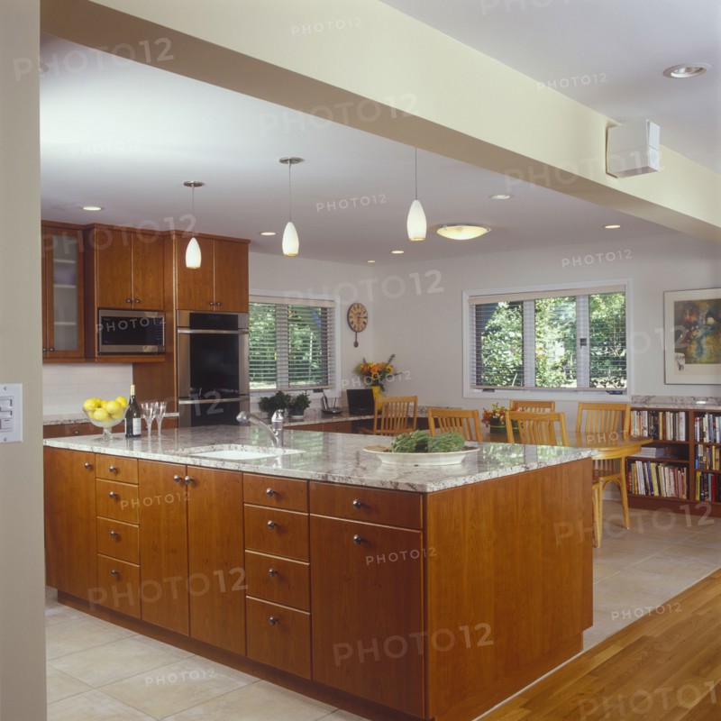 View towards island counter and family eating area