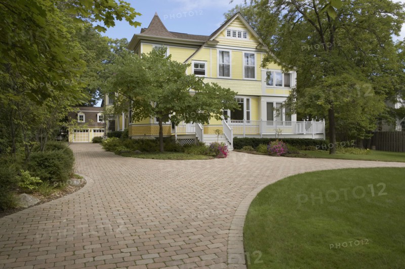 Yellow clapboard Victorian with white trim
