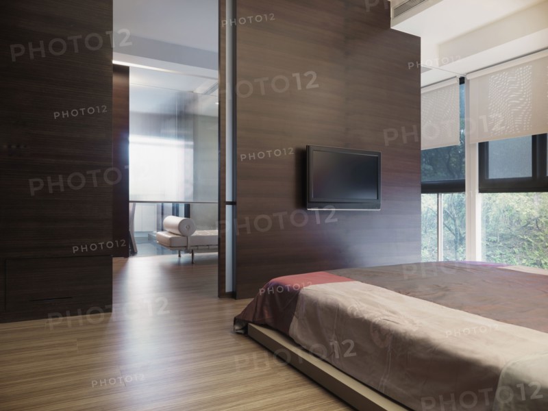 Simple modern bedroom with flat screen television