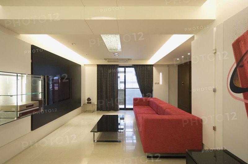 Modern living room with red sofa