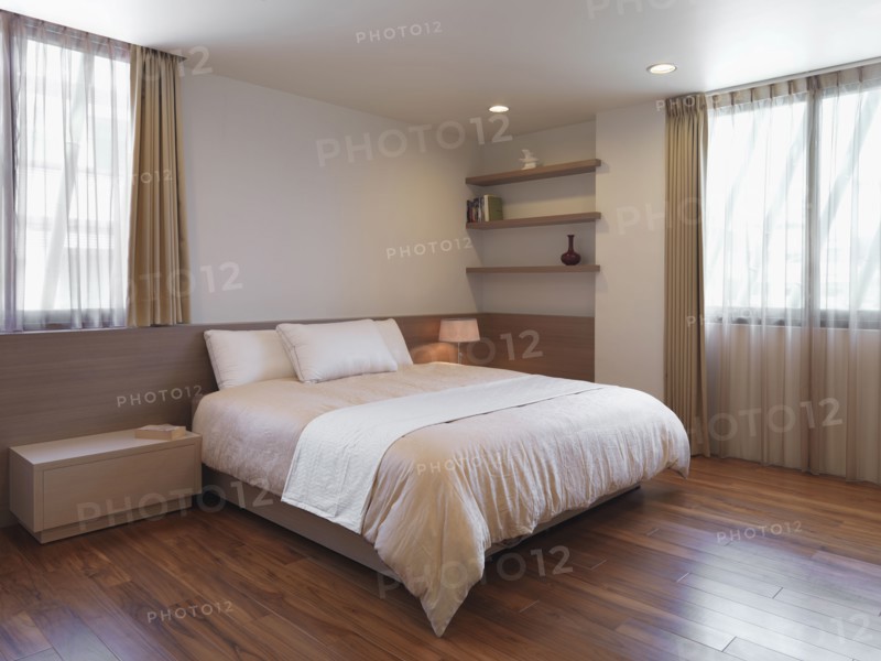 Simple minimalist bedroom with hardwood floors