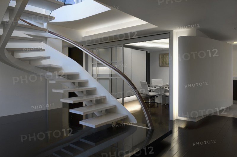 Modern white staircase with glass banister