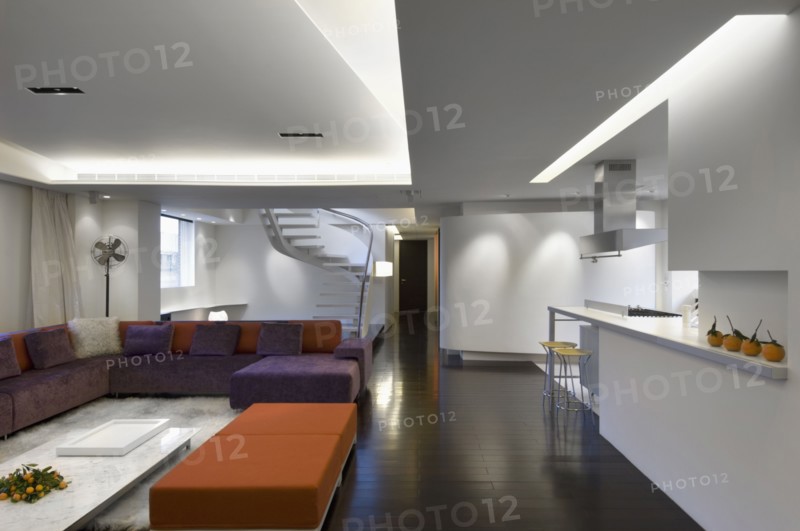 Modern interior with orange and purple furnishings