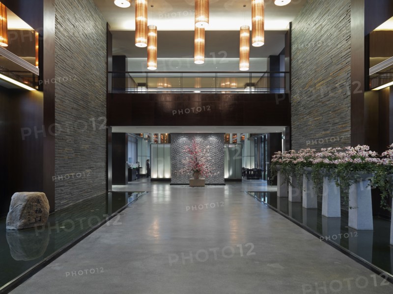 Large hallway with cherry blossom plants