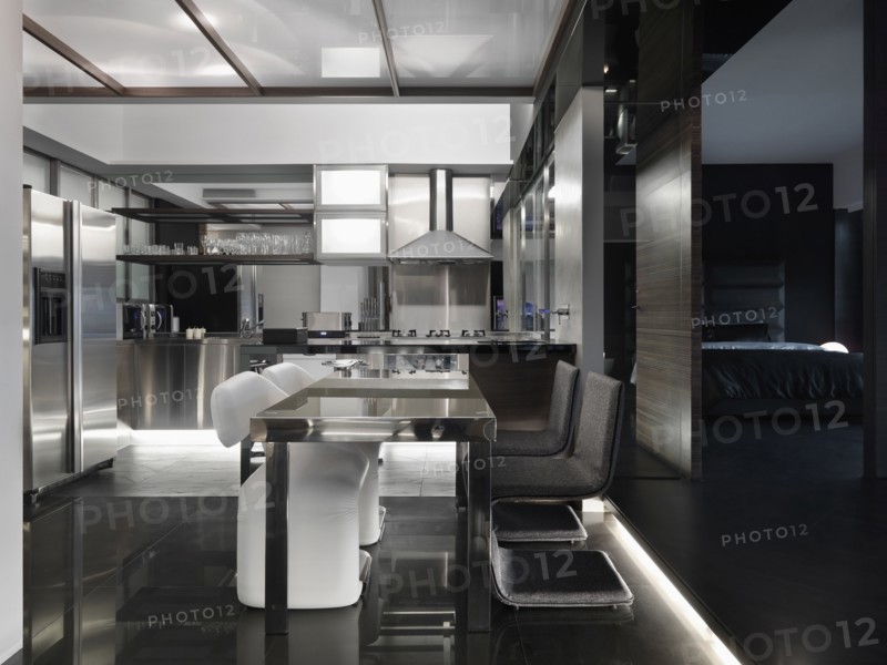Modern black and white kitchen and dining area
