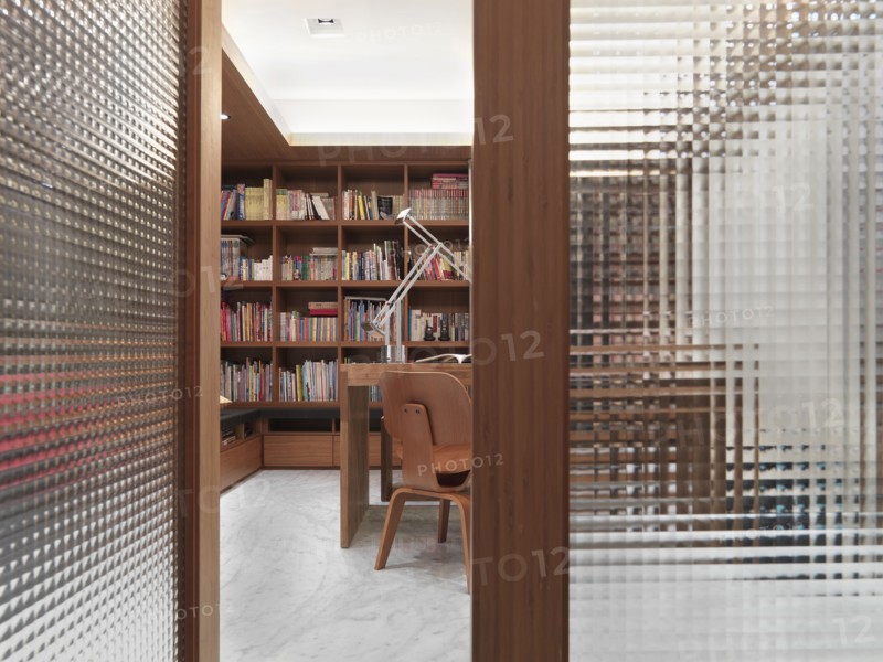 Open translucent doors leading to modern home office