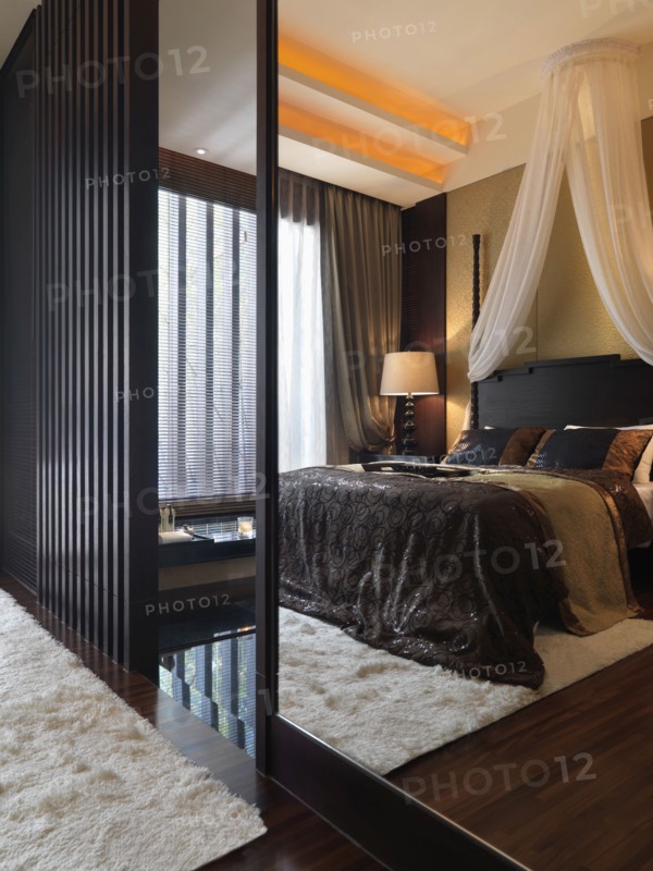 Reflection of master bedroom in mirror