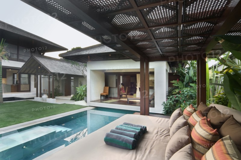Large outdoor sofa bed by pool