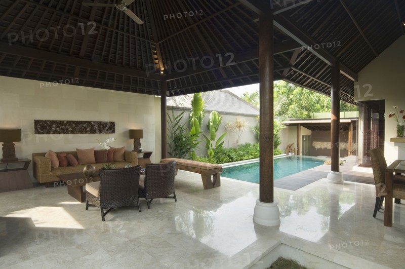 Contemporary sitting area opened up to private pool