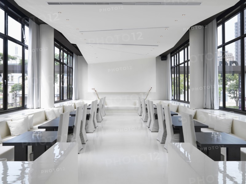 Long narrow white modern dining room