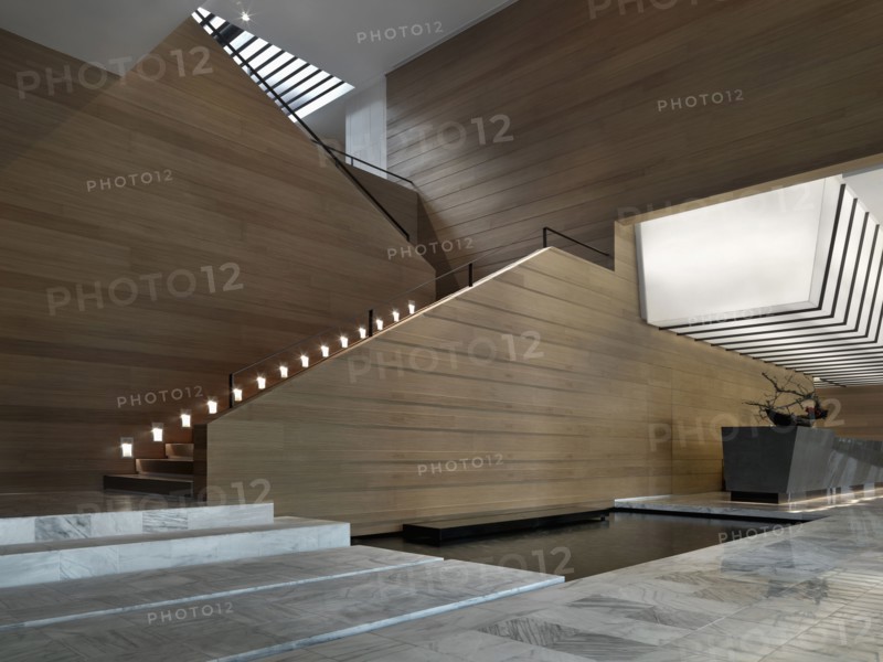 Large contemporary staircase with recessed guide lights