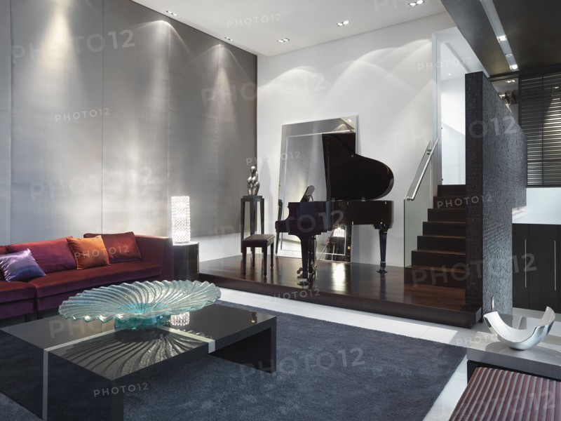 Modern living room with baby grand piano