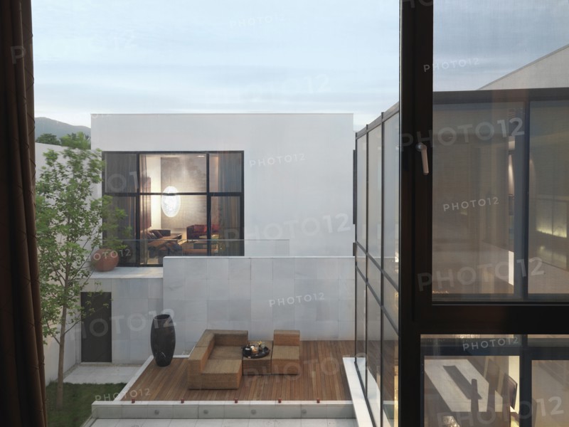 View of exterior of modern home and deck