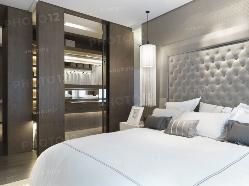 Large bed with collection of throw pillows