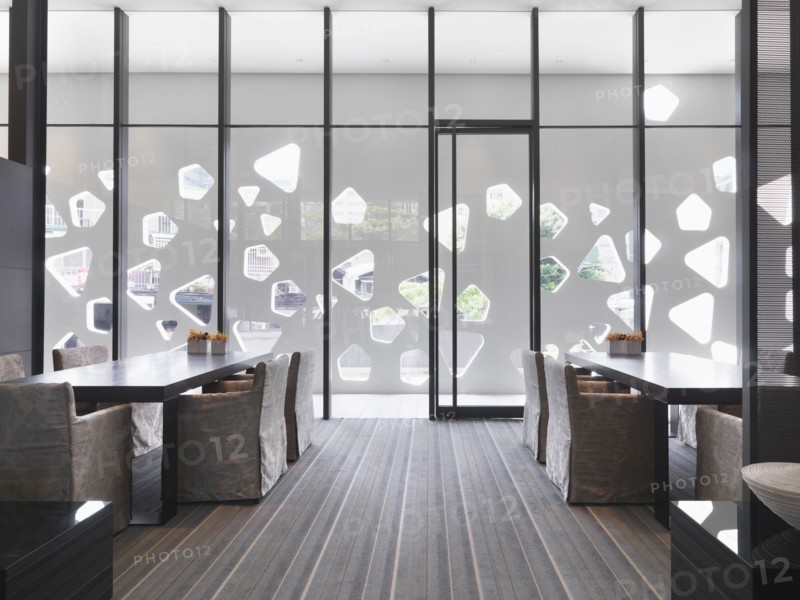 Floor to ceiling windows in modern dining room