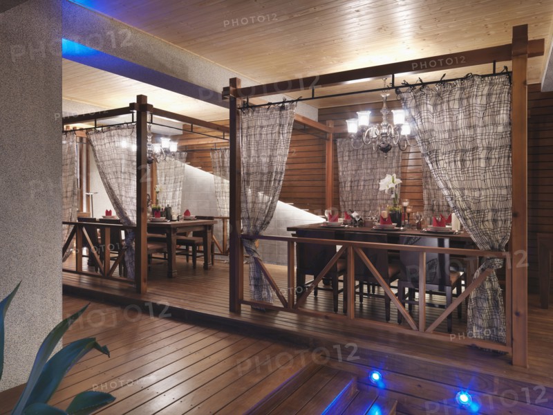 Dining table with chandeliers set up on back deck