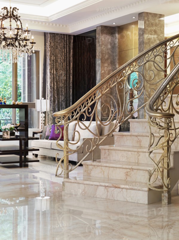 Staircase with intricate metal balusters and marble surface