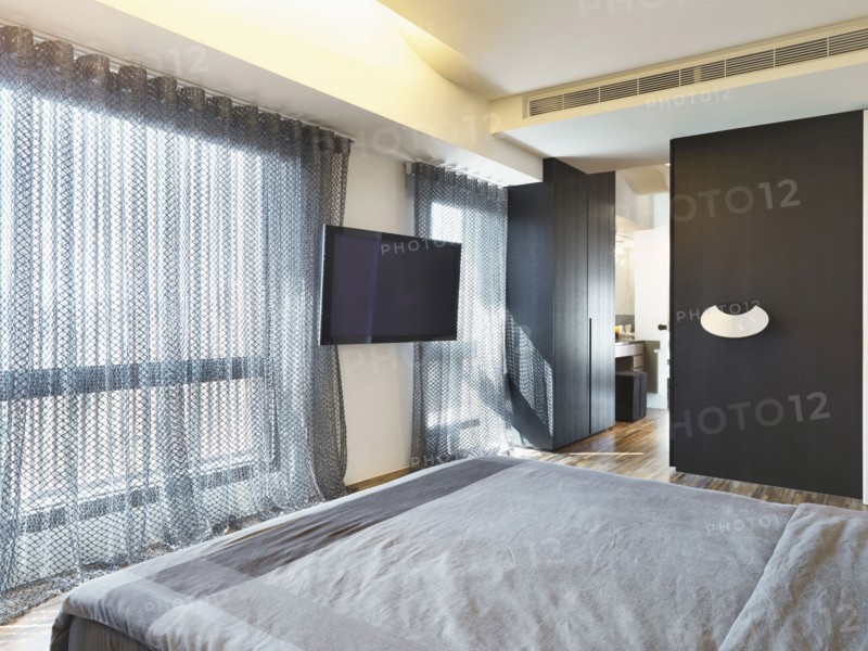 Large window in modern bedroom