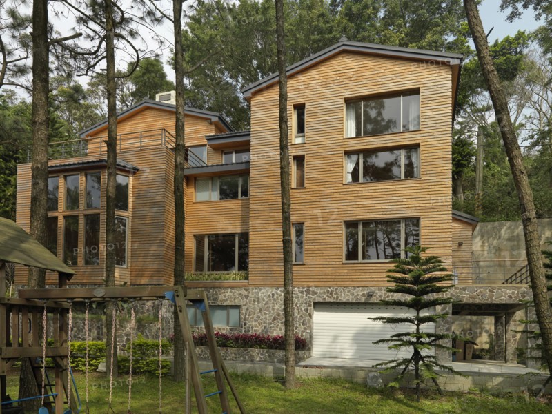 Exterior view of cabin with swing set in backyard