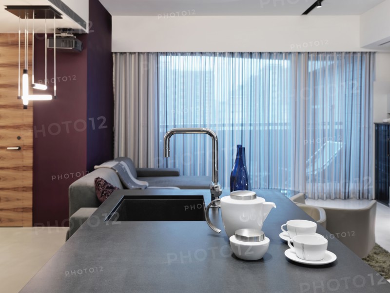 View down kitchen island to living room