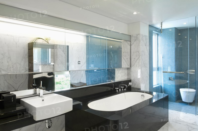 Black bathtub in modern marble bathroom